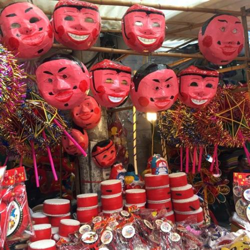 Masks and tomtoms at Hang Ma Street.